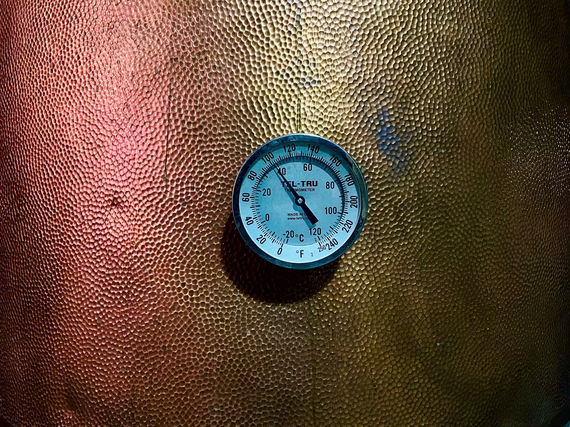 Close-up of a copper pot still gauge at an artisanal Kentucky bourbon distillery