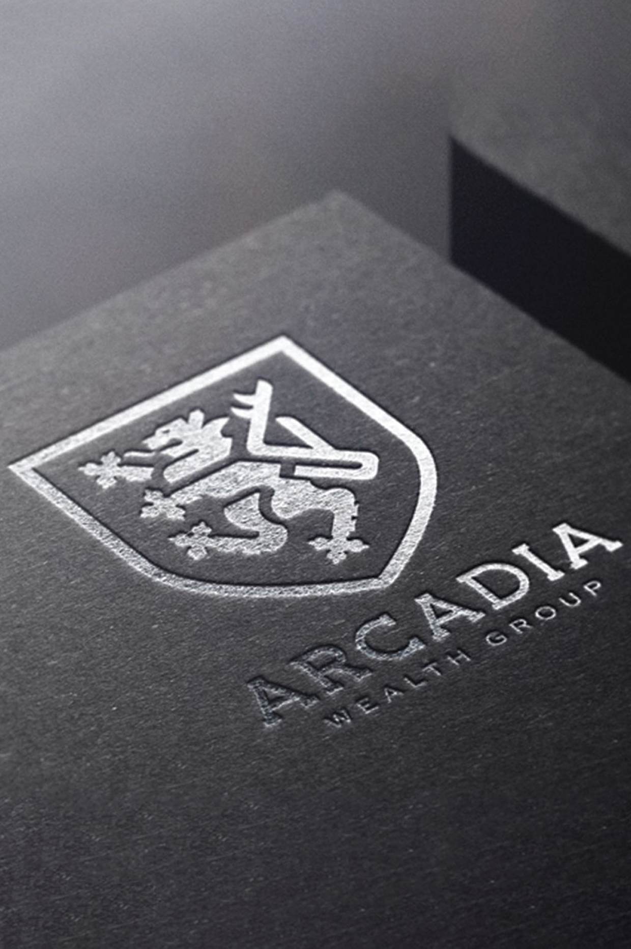a foil stamp mockup of the arcadia wealth logo