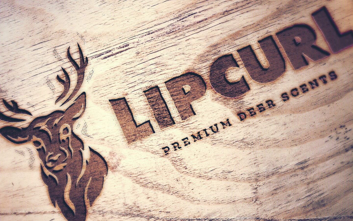 a logo mockup for lip curl deer scents on wood