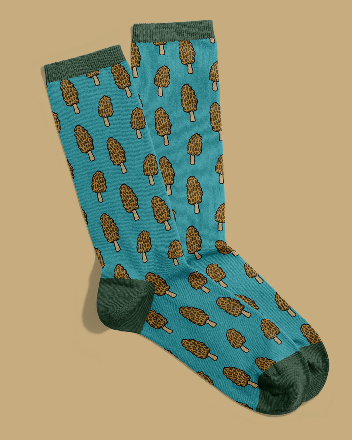 a mockup of a pair of socks with morel mushroom illustrations