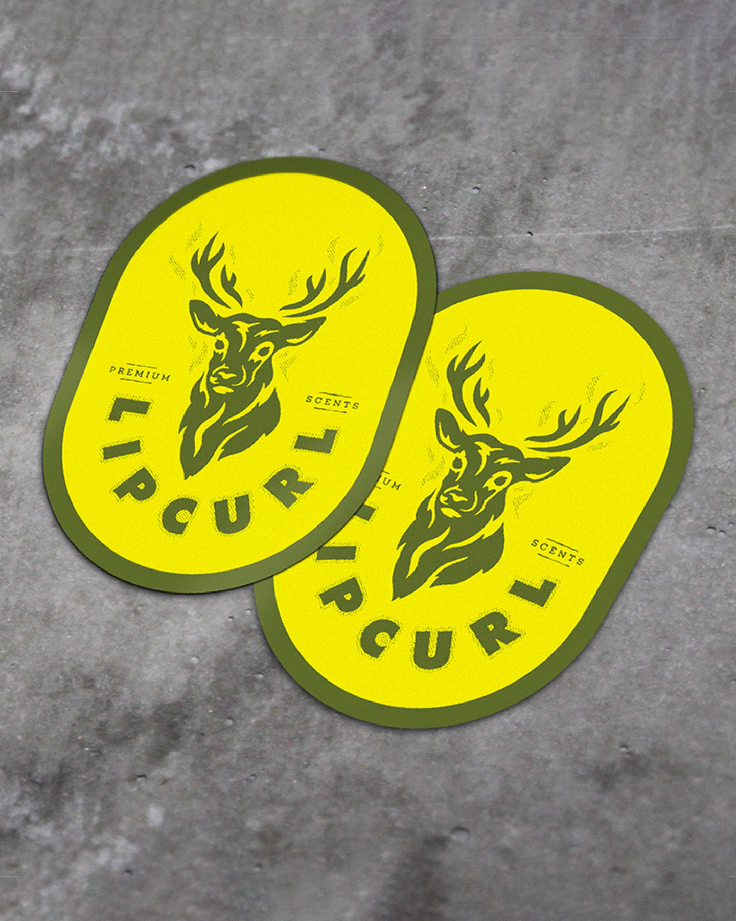a mockup of two stickers for lip curl deer scents