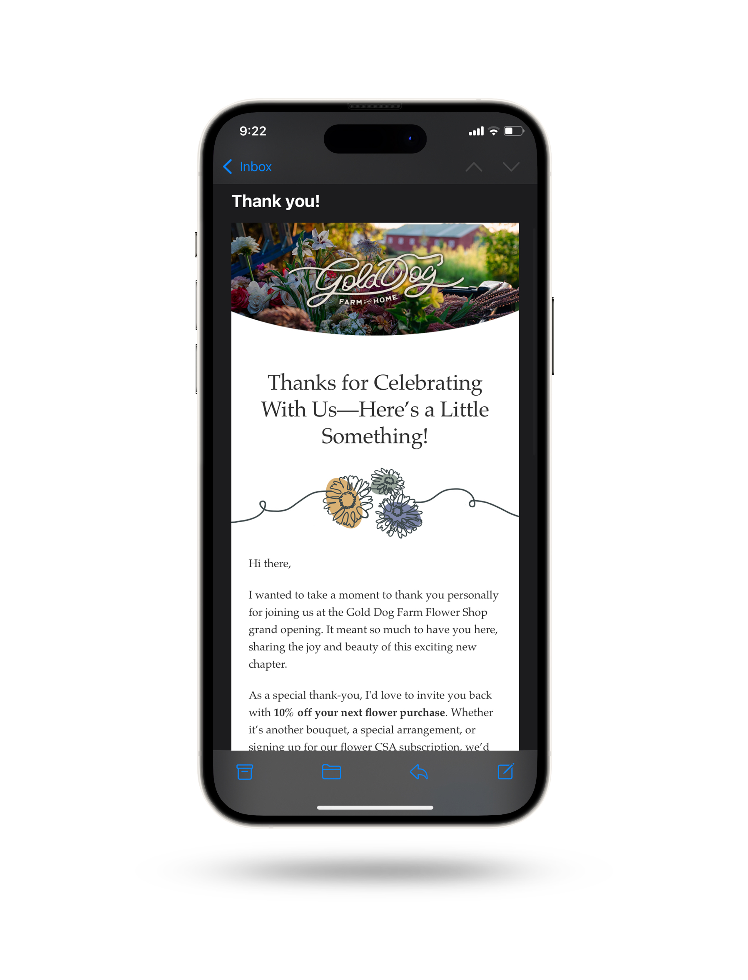 a mockup of an iphone with gold dog farm's email marketing design
