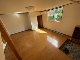 Rustic Wooden Living Area – Open space with aged wood interiors, ready for restoration.