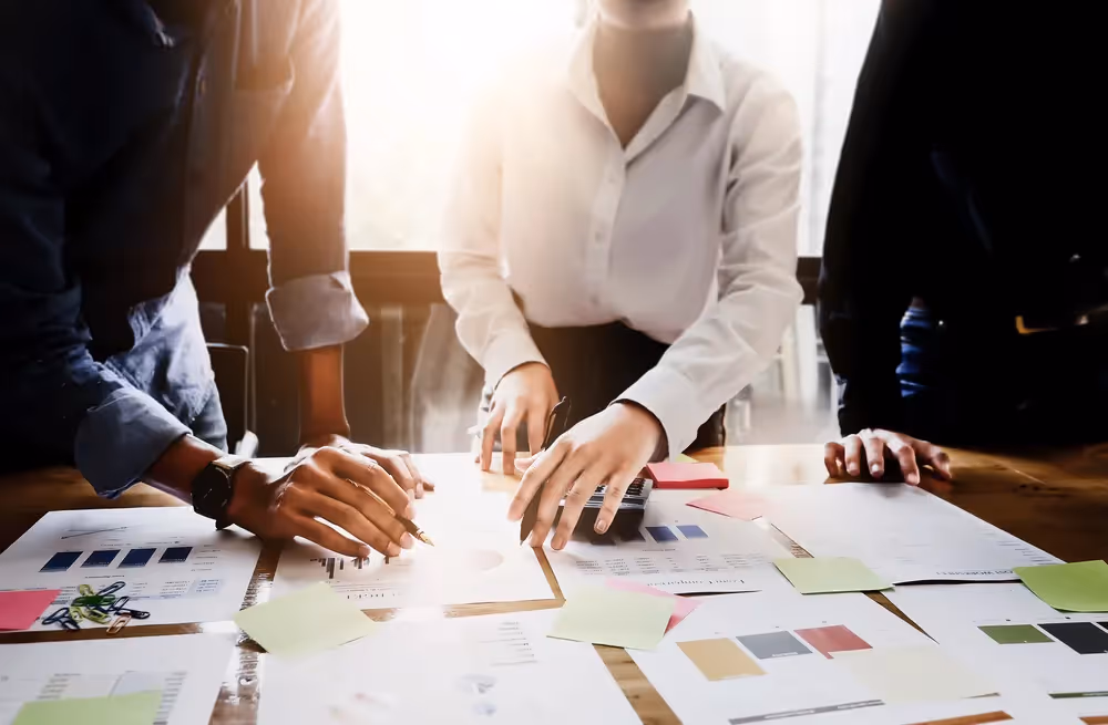 a group of people working on a table
