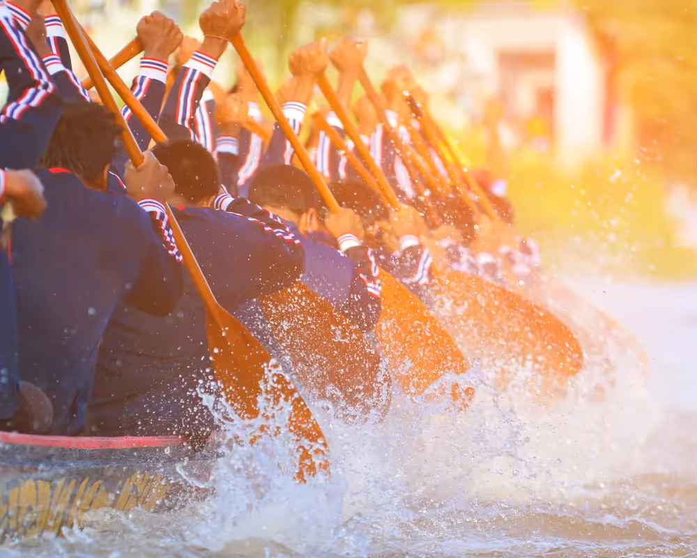 a group of people in a boat on a river