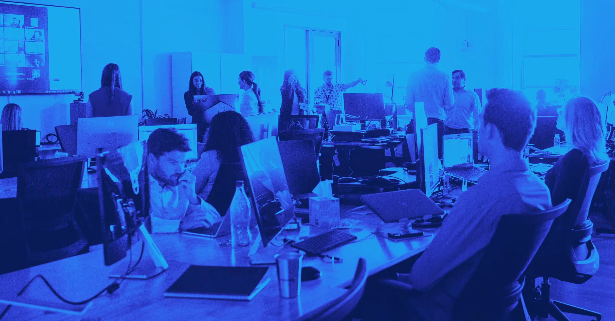 a group of people working in an office