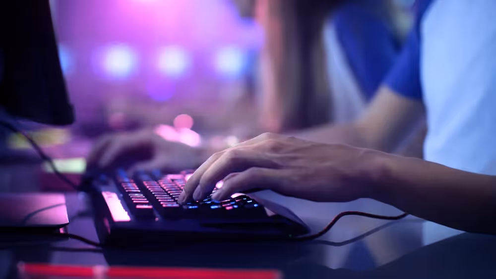 a person typing on a keyboard