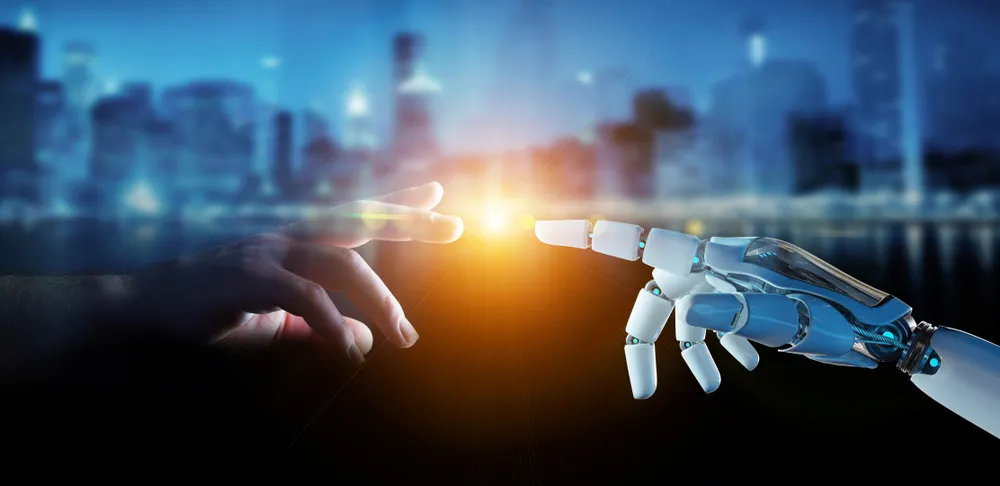 a robot hand reaching a human hand