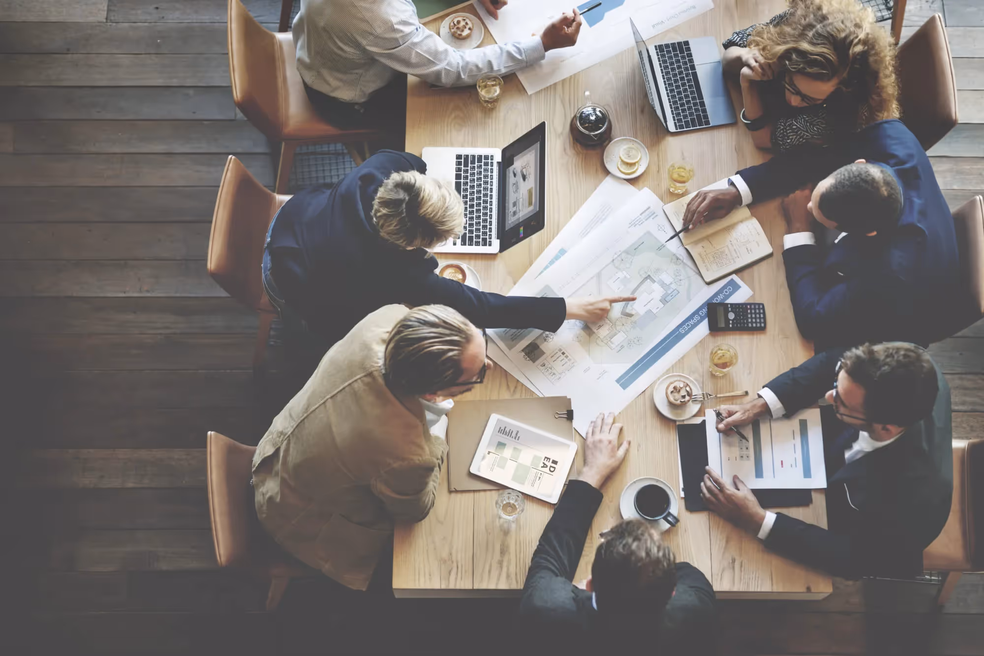 a group of people sitting around a table