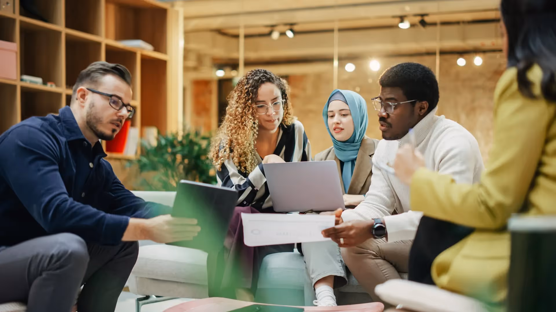 a group of people sitting around a table