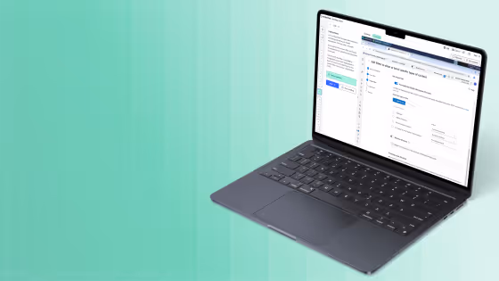 Laptop with a software interface displaying project or task management features on screen.