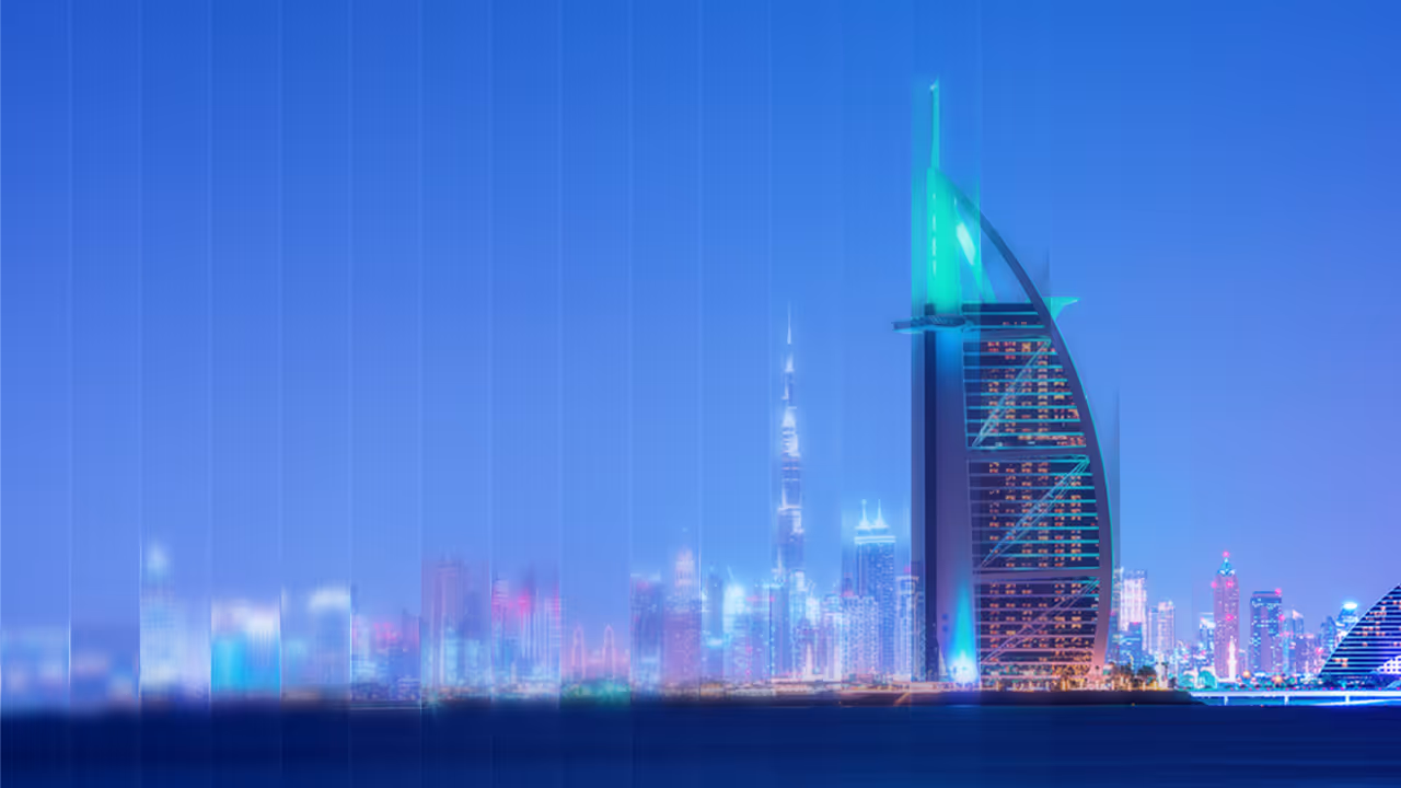 Night skyline of Dubai with illuminated Burj Al Arab and Burj Khalifa skyscrapers by the water.