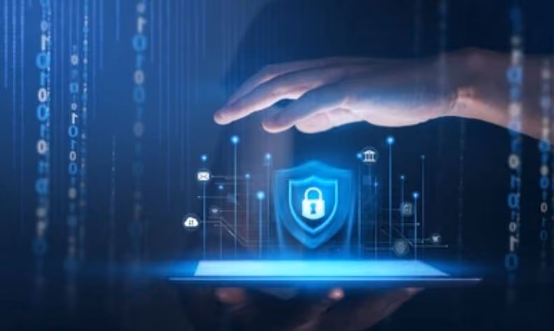 Hand hovering over digital shield with lock icon and security symbols above a tablet screen.