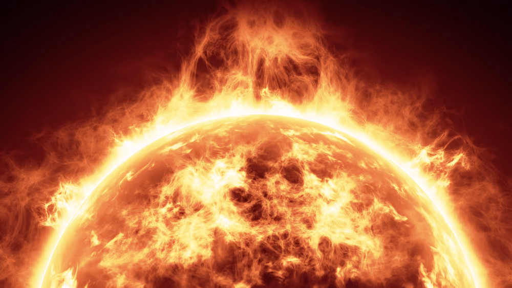 Close-up of the sun with fiery solar flares and glowing plasma surface against dark background.