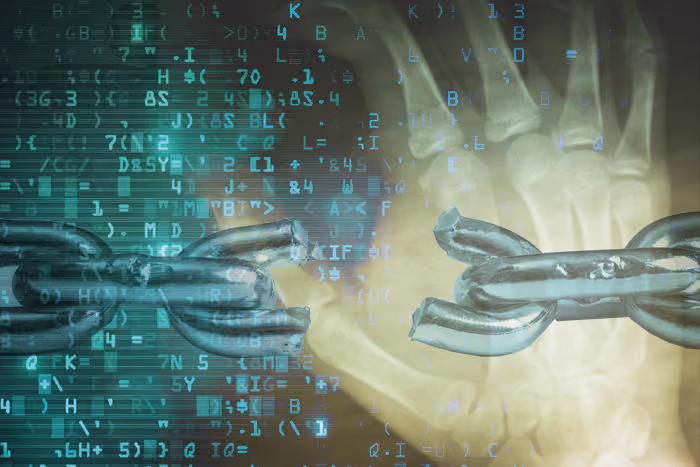 Broken chain link overlaid on an X-ray image of a human hand with digital code symbols.