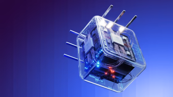 Transparent cube with electronic circuits and glowing lights inside on a blue gradient background.