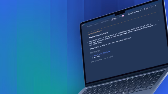 Open laptop showing code editor with dark theme and programming text on a blue gradient background.