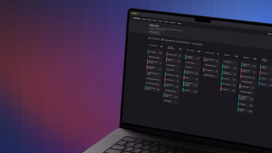 Laptop screen showing a dark-mode project management or task board interface with columns and colored tags.