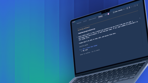 Open laptop showing code editor with dark theme and programming text on a blue gradient background.