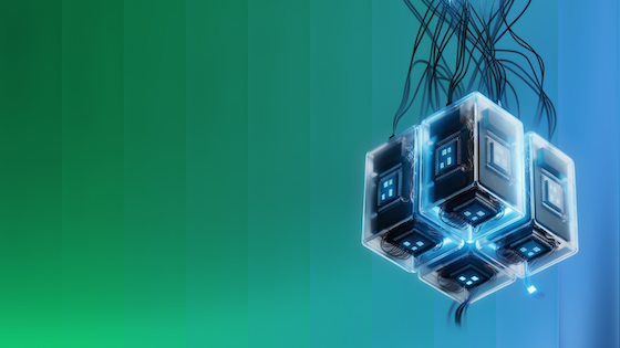 Glowing futuristic cube-shaped device with wires suspended against a green-to-blue gradient background.