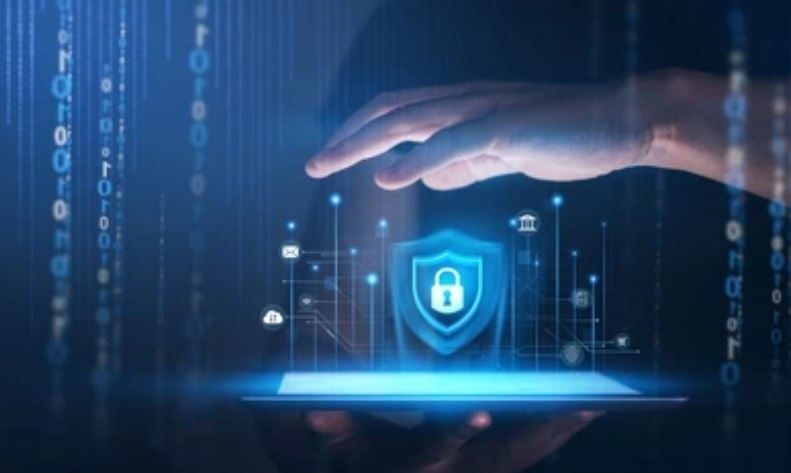 Hand hovering over a digital shield with a lock symbol, representing cybersecurity protection.