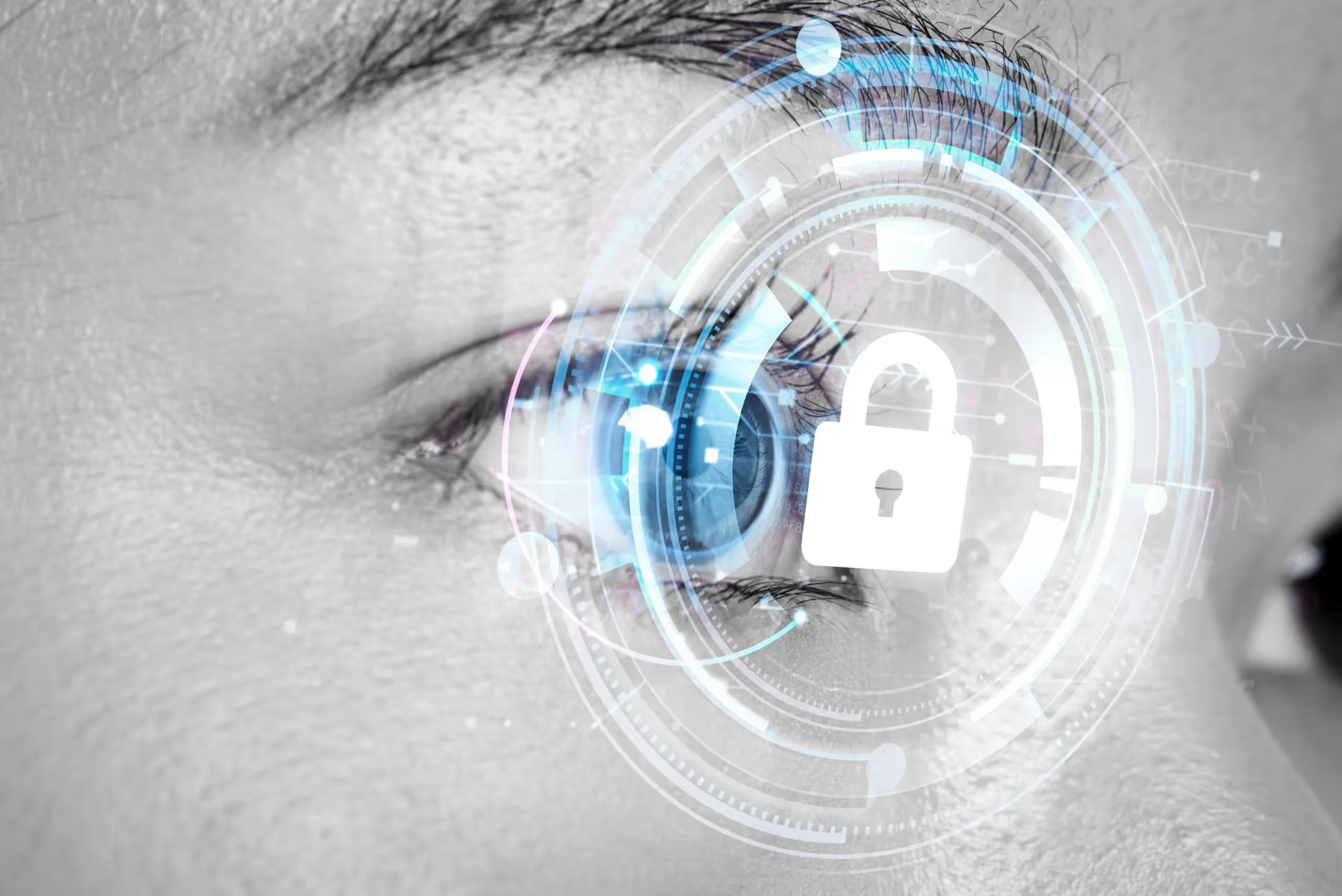 Close-up of an eye overlaid with a padlock and digital interface.