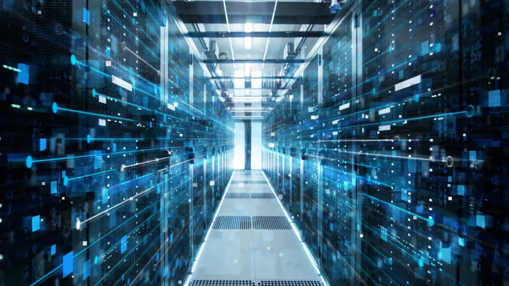 Server racks lining a data center aisle with blue digital overlays.