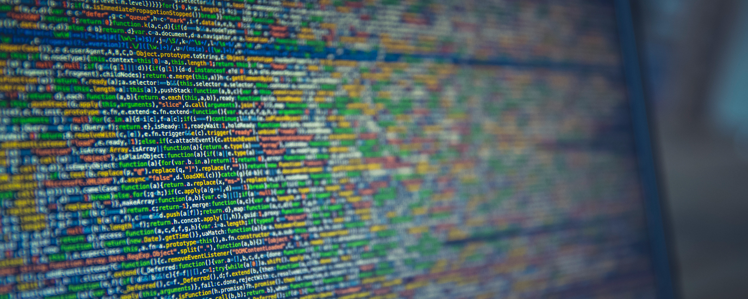 Close-up of colorful programming code displayed on a computer screen with a blurred background.