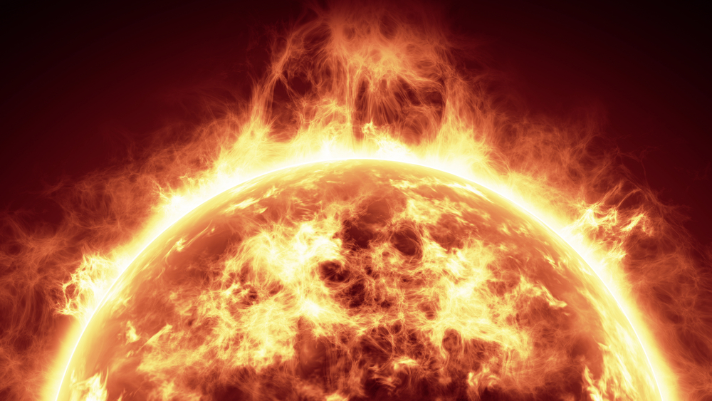 Close-up of the sun with fiery solar flares and glowing plasma surface against dark background.