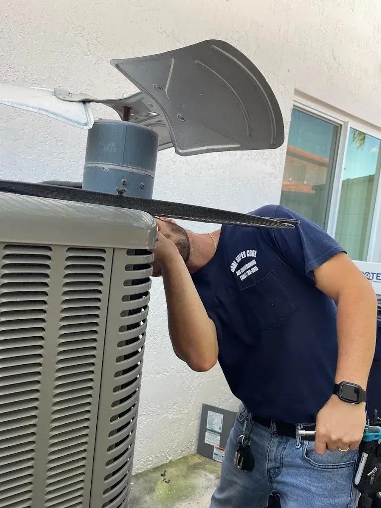 Close-up of an air conditioning unit showing signs of failure, emphasizing the need for emergency repair