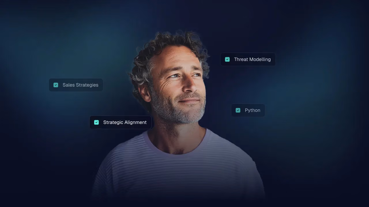 Man looking off camera ringed by skill tags: Sales Strategies, Strategic Alignment, Threat Modelling, Python