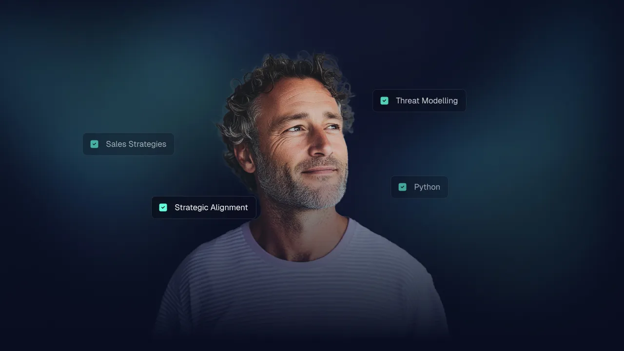 Man looking off camera ringed by skill tags: Sales Strategies, Strategic Alignment, Threat Modelling, Python