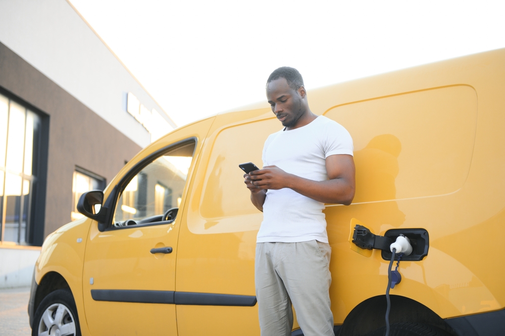 Driver doing vehicle checks on a phone
