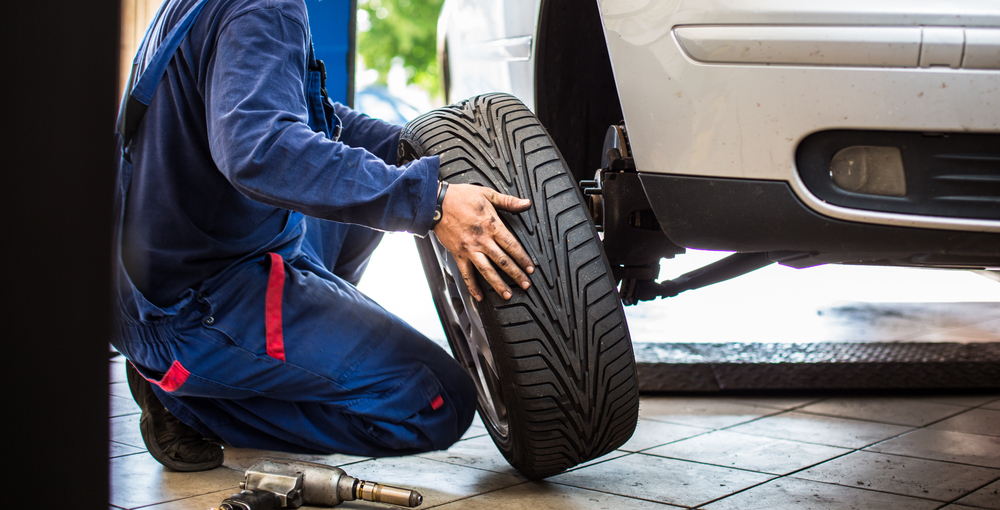 Mechanic fixing a tyre