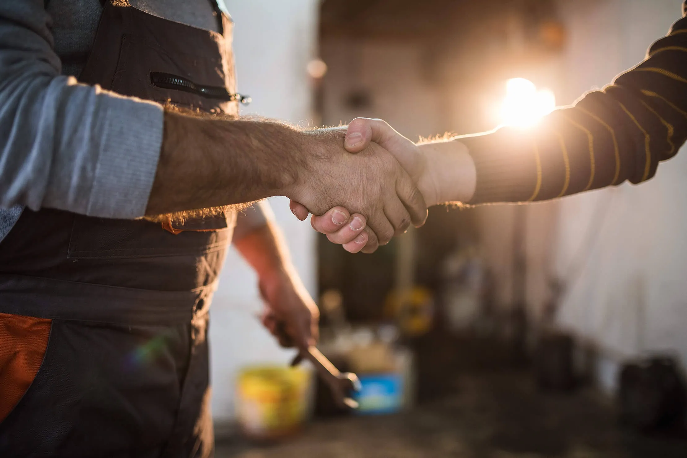 Driver and mechanic shaking hands