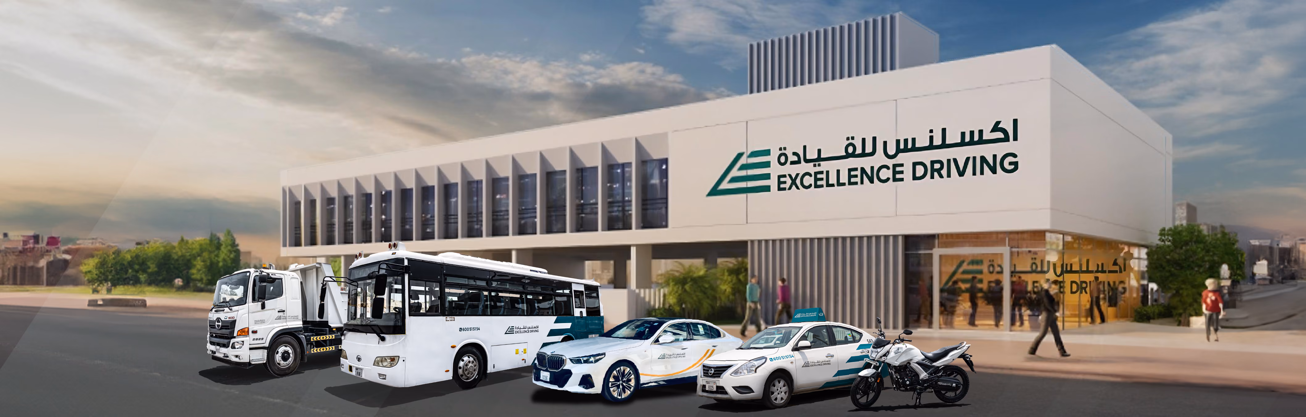 Exterior of the Excellence Driving center with a fleet of cars, a bus, a truck, and a motorcycle.