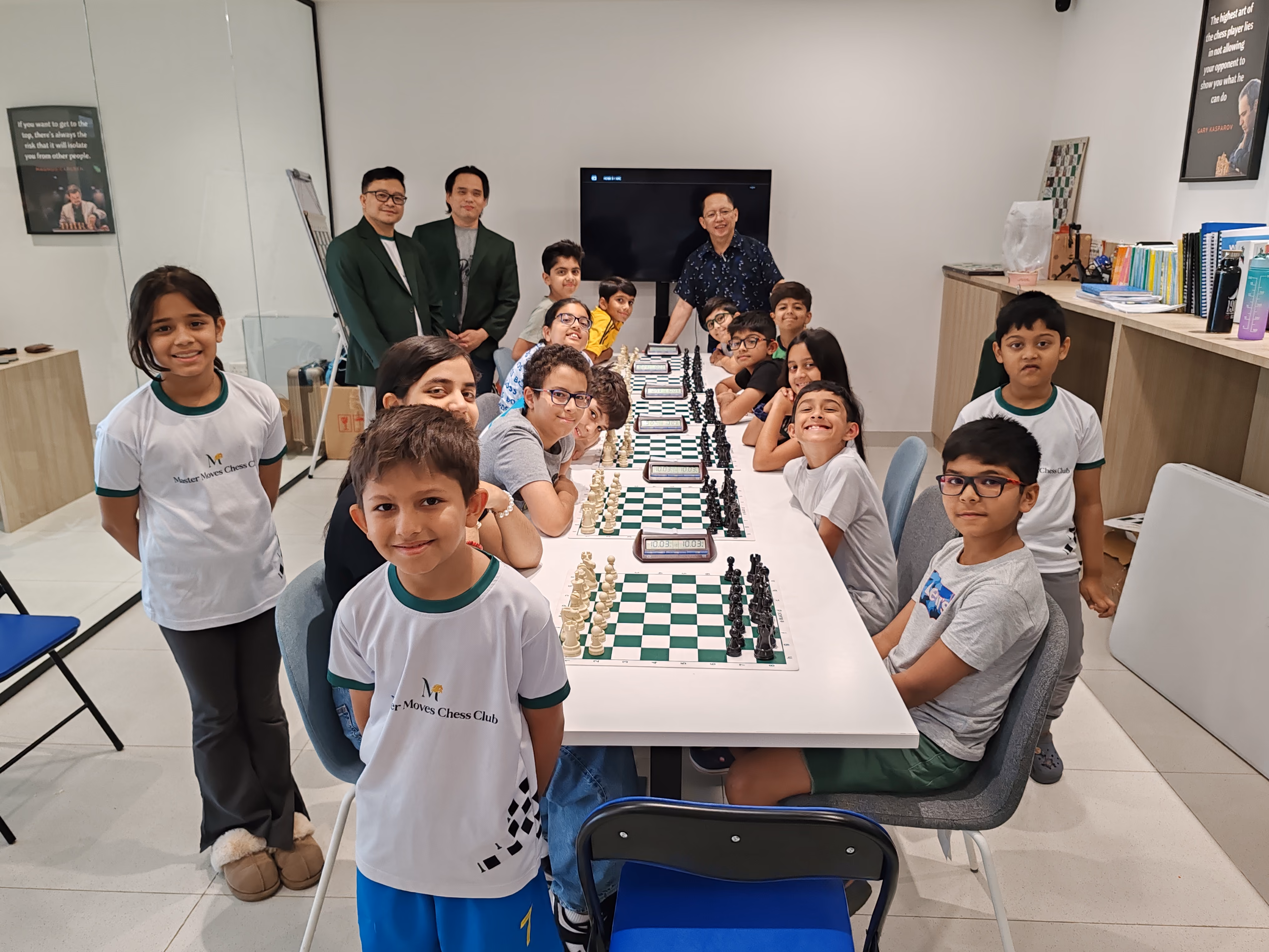 Children smiling at a chess club tournament