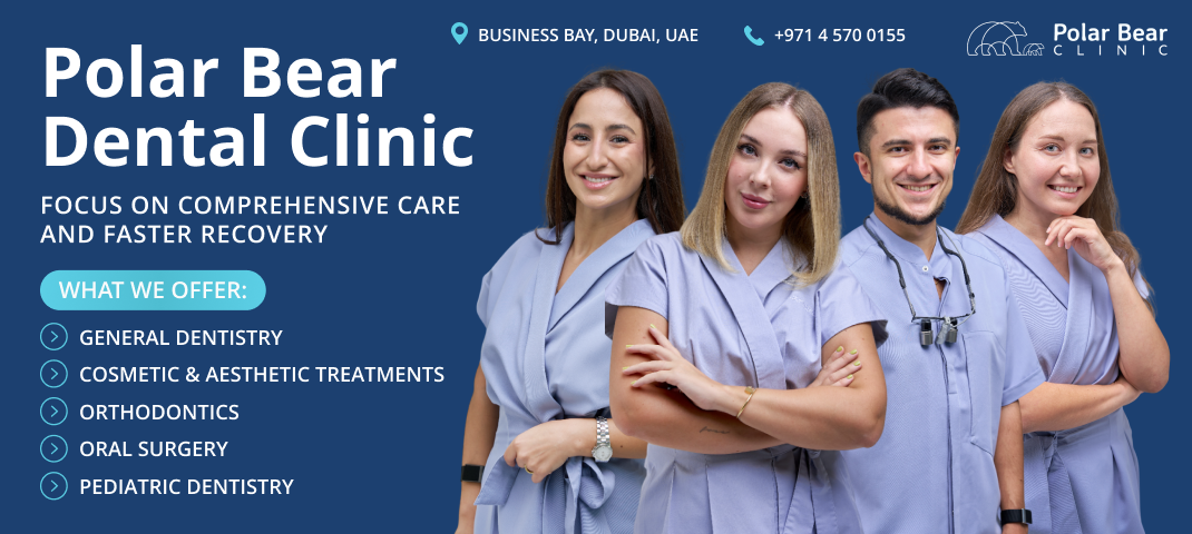 a dental hygienist wearing bunny ears and smiling at a young girl who is sitting in a dental chair