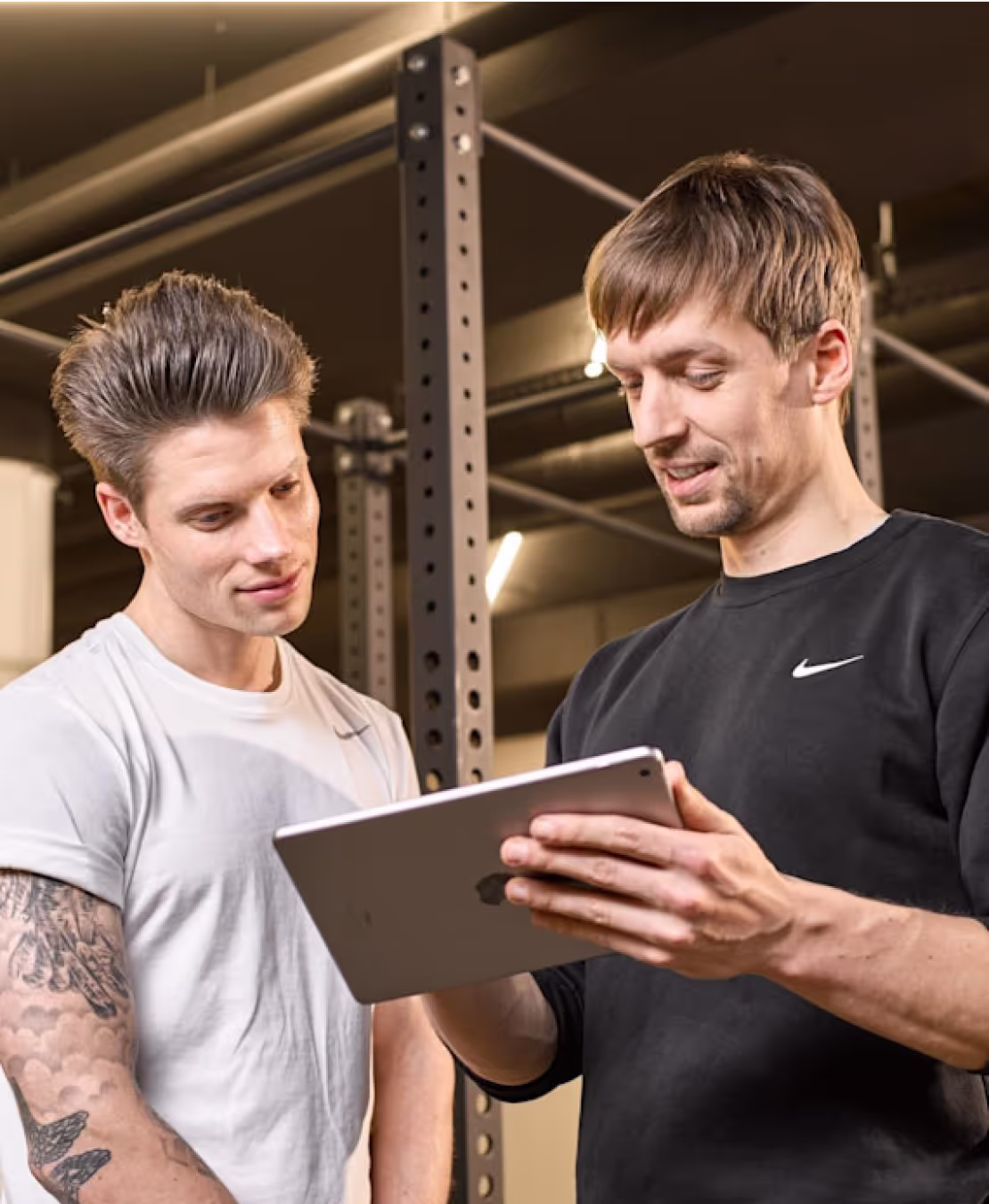 personal trainer assesing progress
