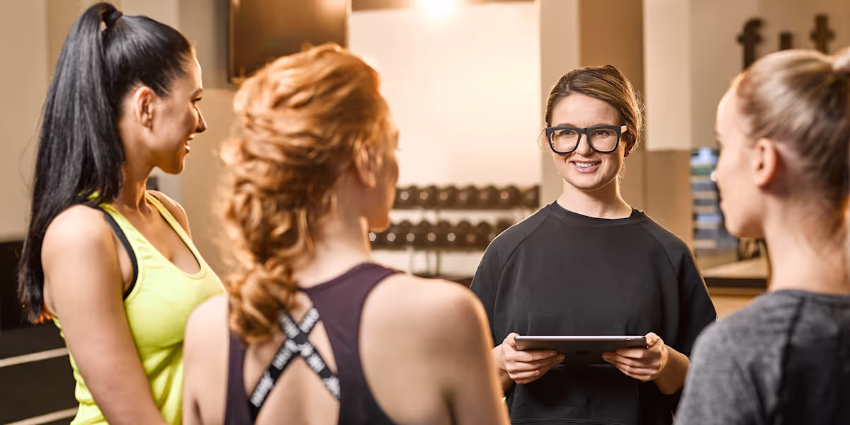 group of women assesed by a personal trainer