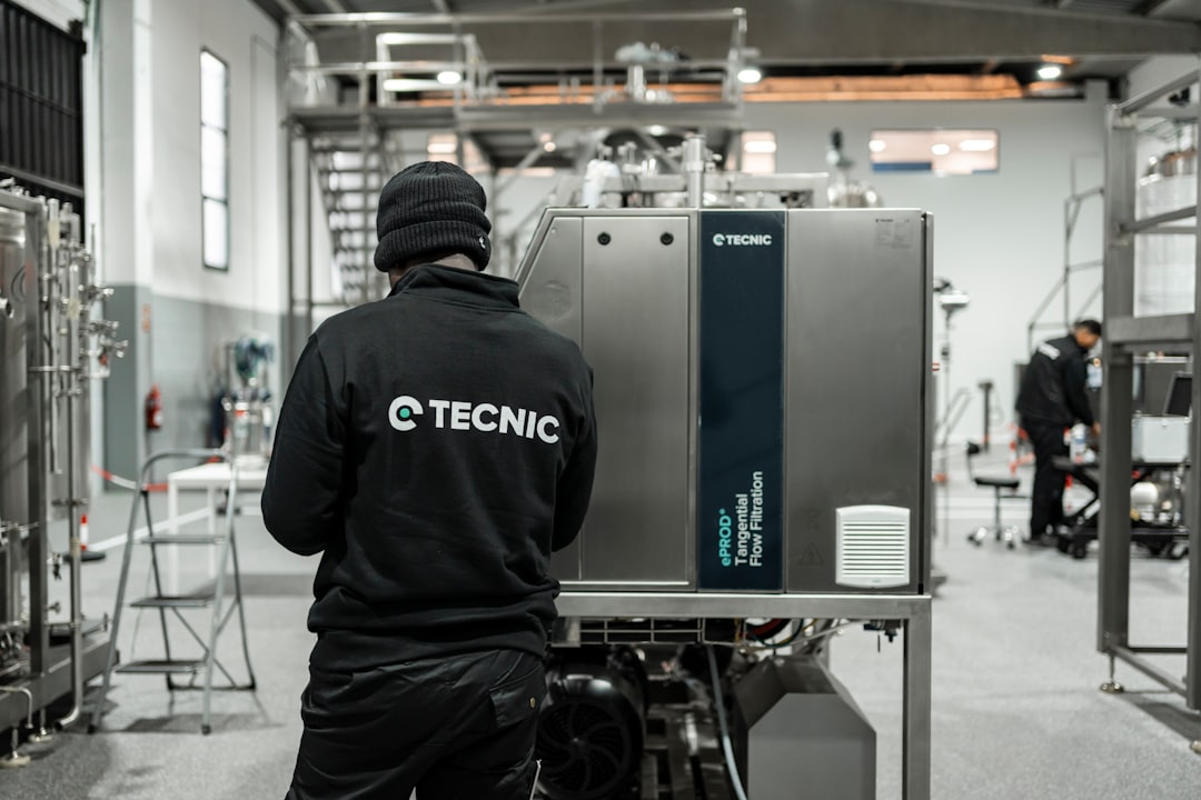 A technician inspecting a large commercial furnace - Furnace repair Zionsville IN A technician inspecting a large commercial furnace - Furnace repair Zionsville IN