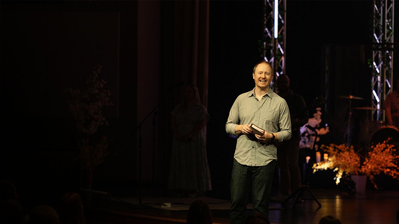 Pastor Brett Cheek on stage, Cape Campus.