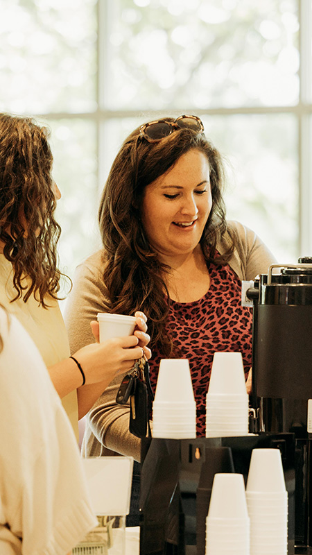 People of multiple generations worshipping together.