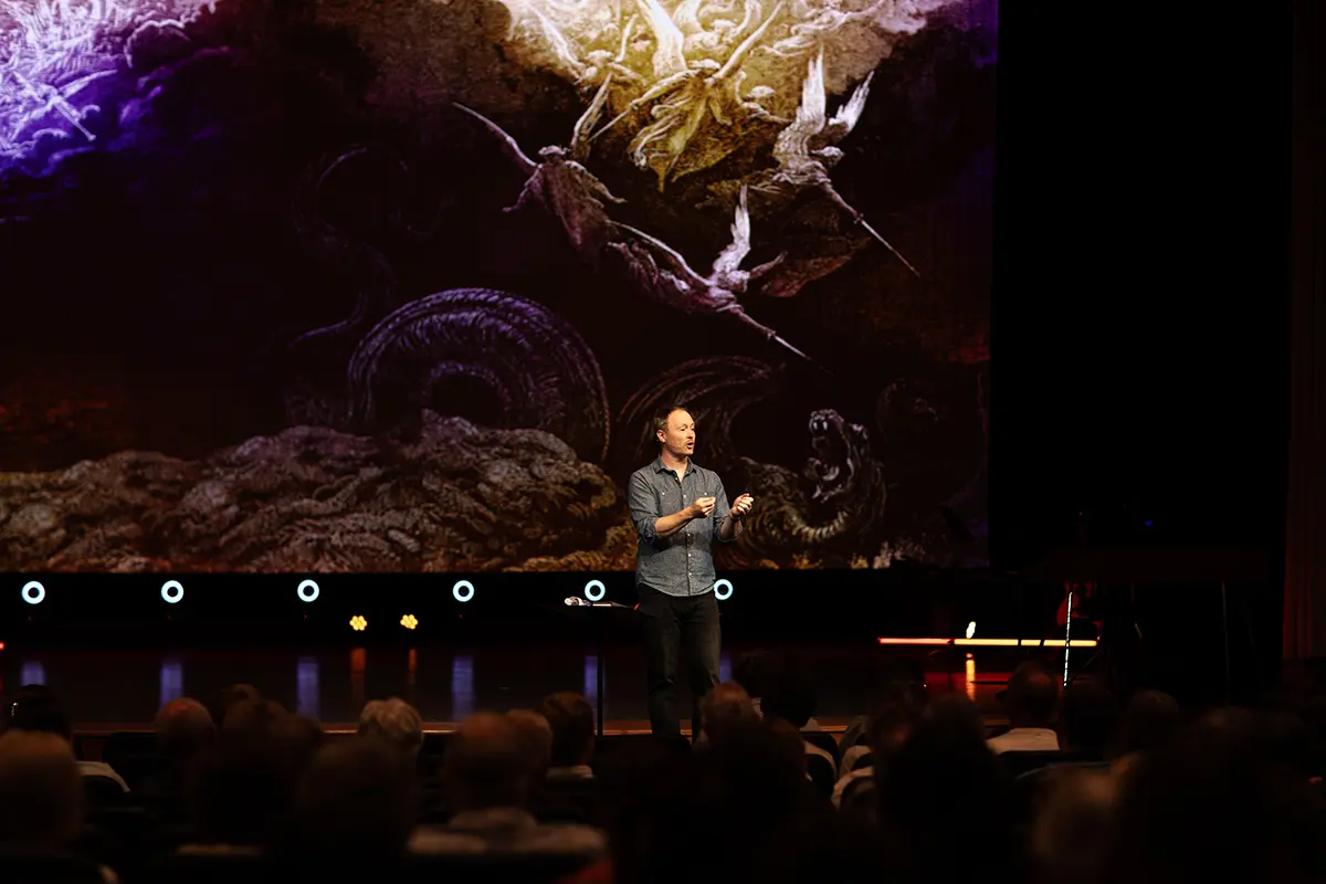 Pastor Brett Cheek on stage, Cape Campus.