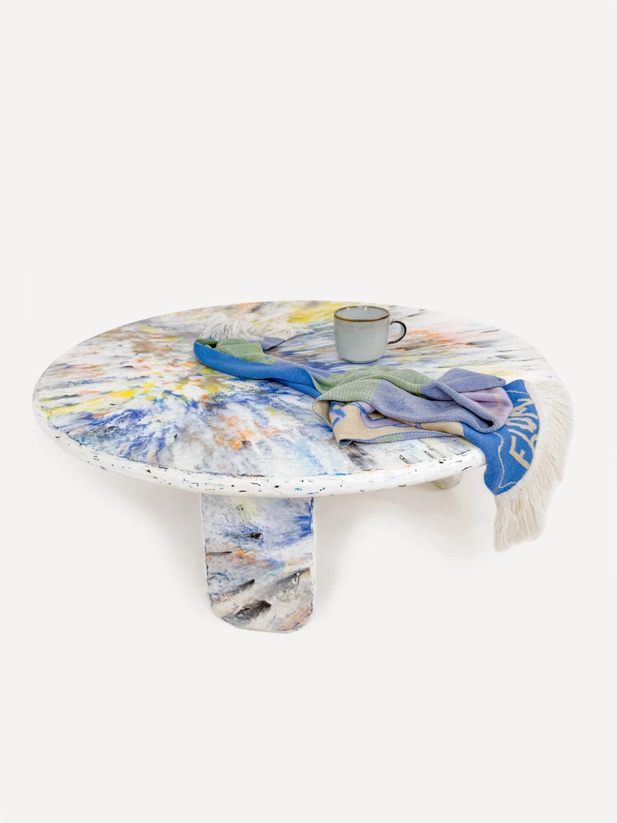 Kaleida table by Revive Innovations - a round mosaic coffee table of colourful recycled plastic arranged in an organic, marbled layered patterns, made from Revive's KRUSHED custom sheet material range.