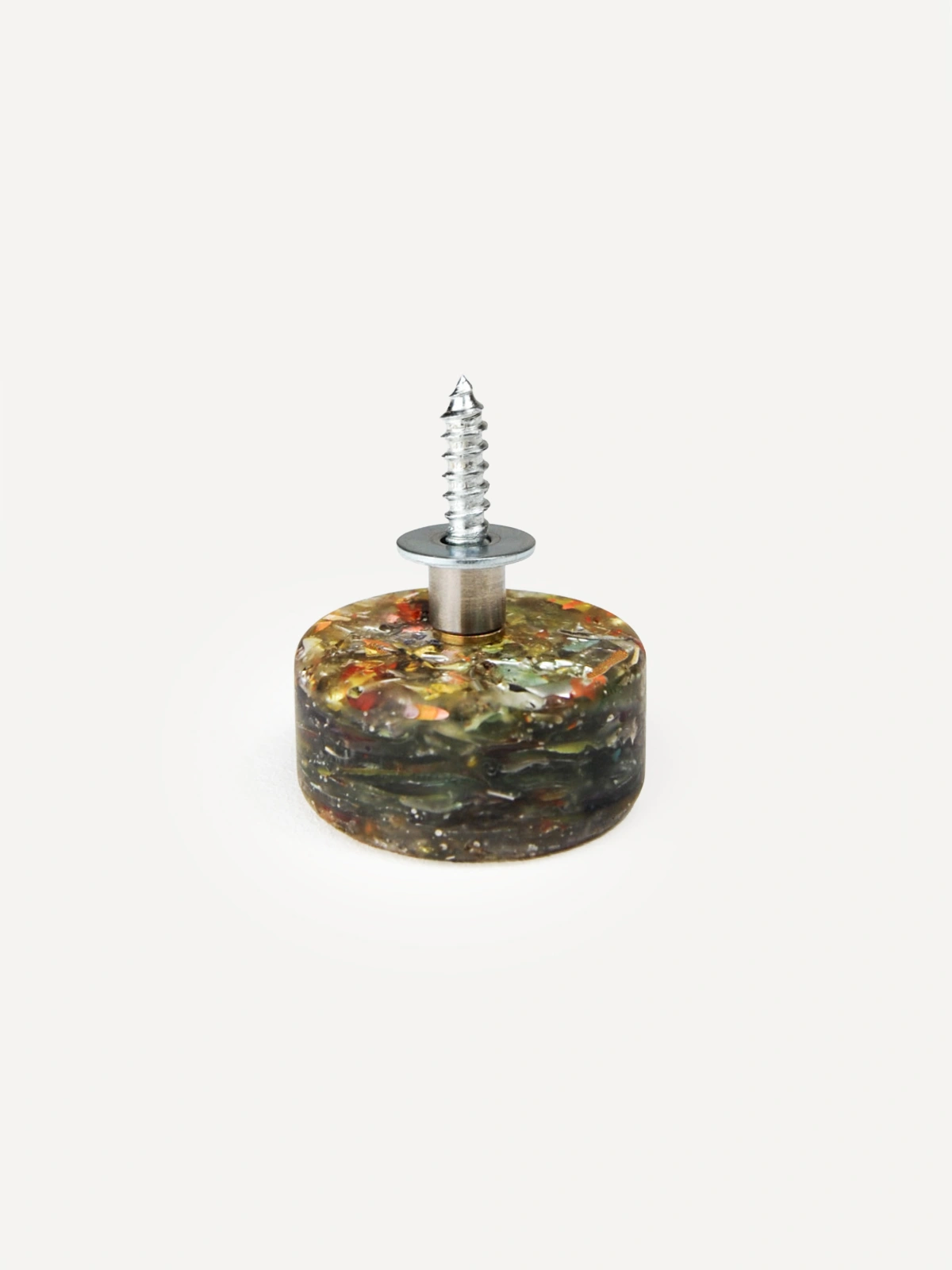Minimalist furniture knobs and wall hooks handcrafted by Revive Innovations from circular recycled plastics.