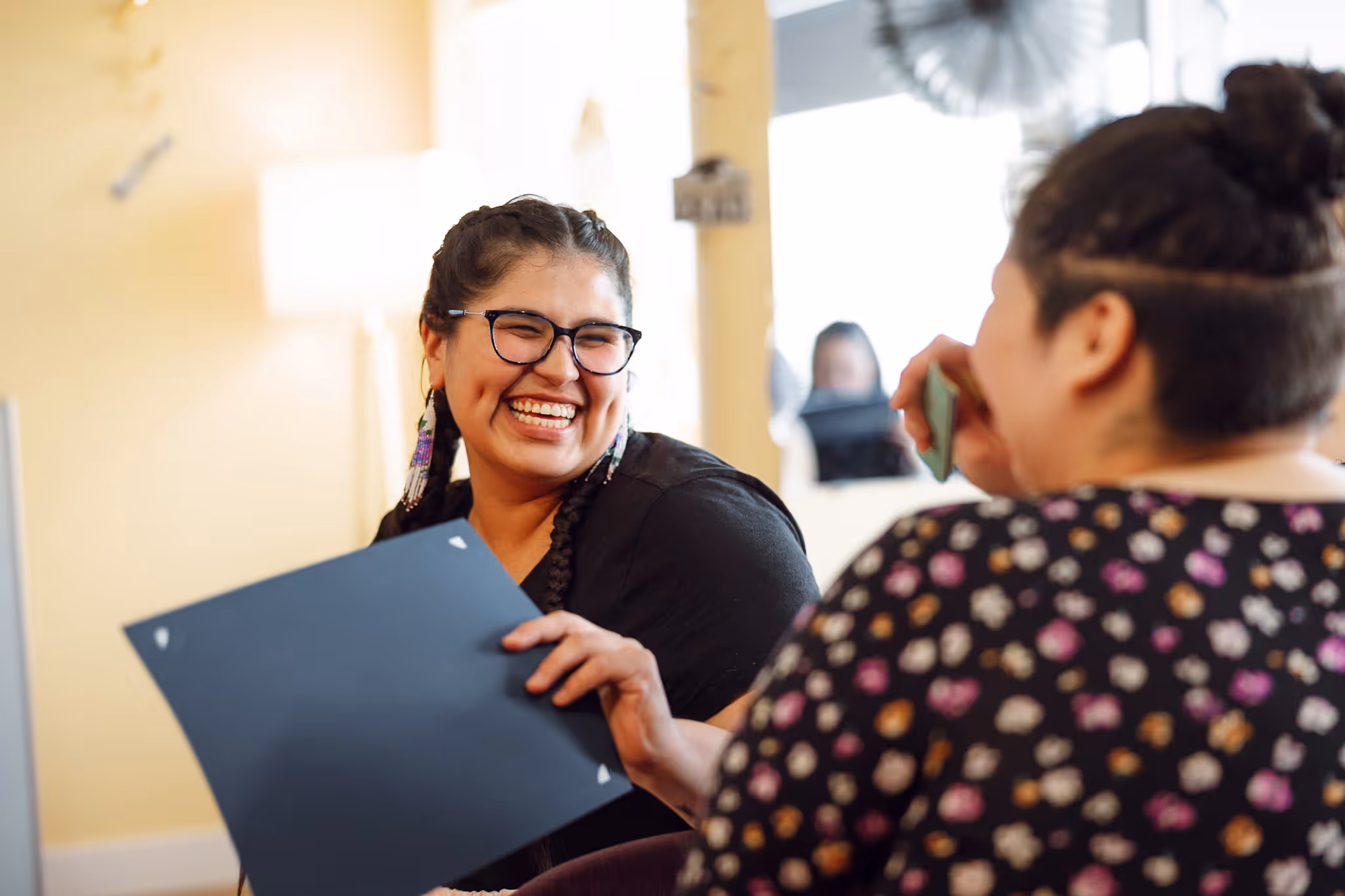 An indigenous participant celebrates graduation marking significant milestone in her journey.