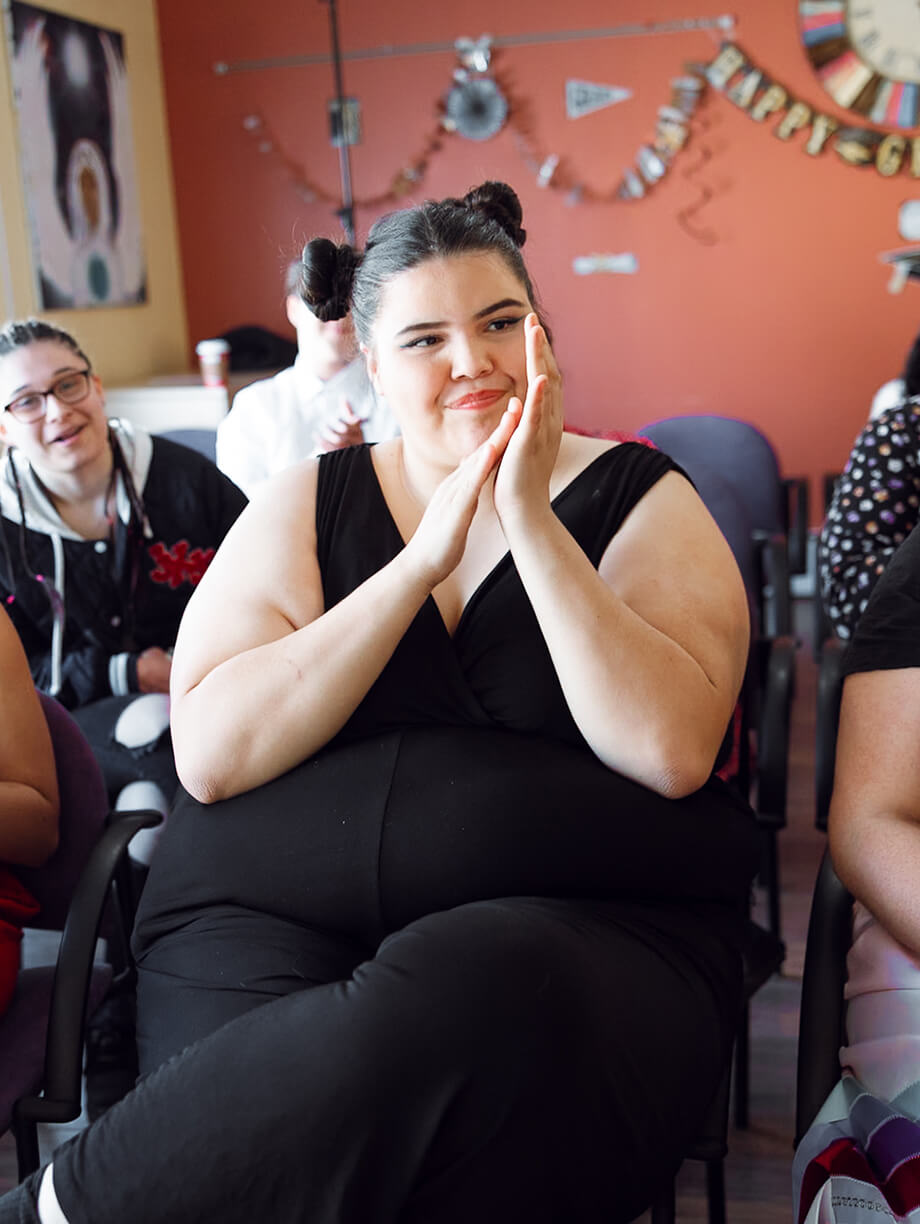 An indigenous participant celebrates at TMC's graduation event, a reflection of their growth.