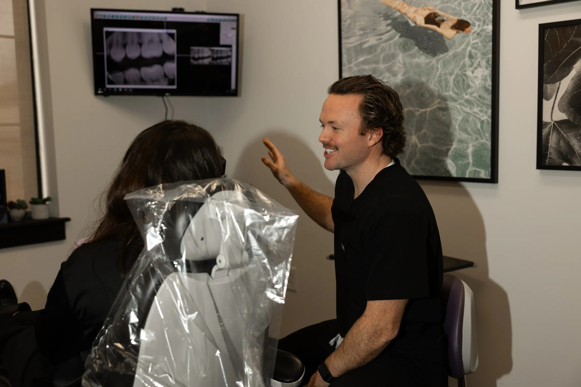 Dr. Phillip Martin Ray Jr talking to a patient