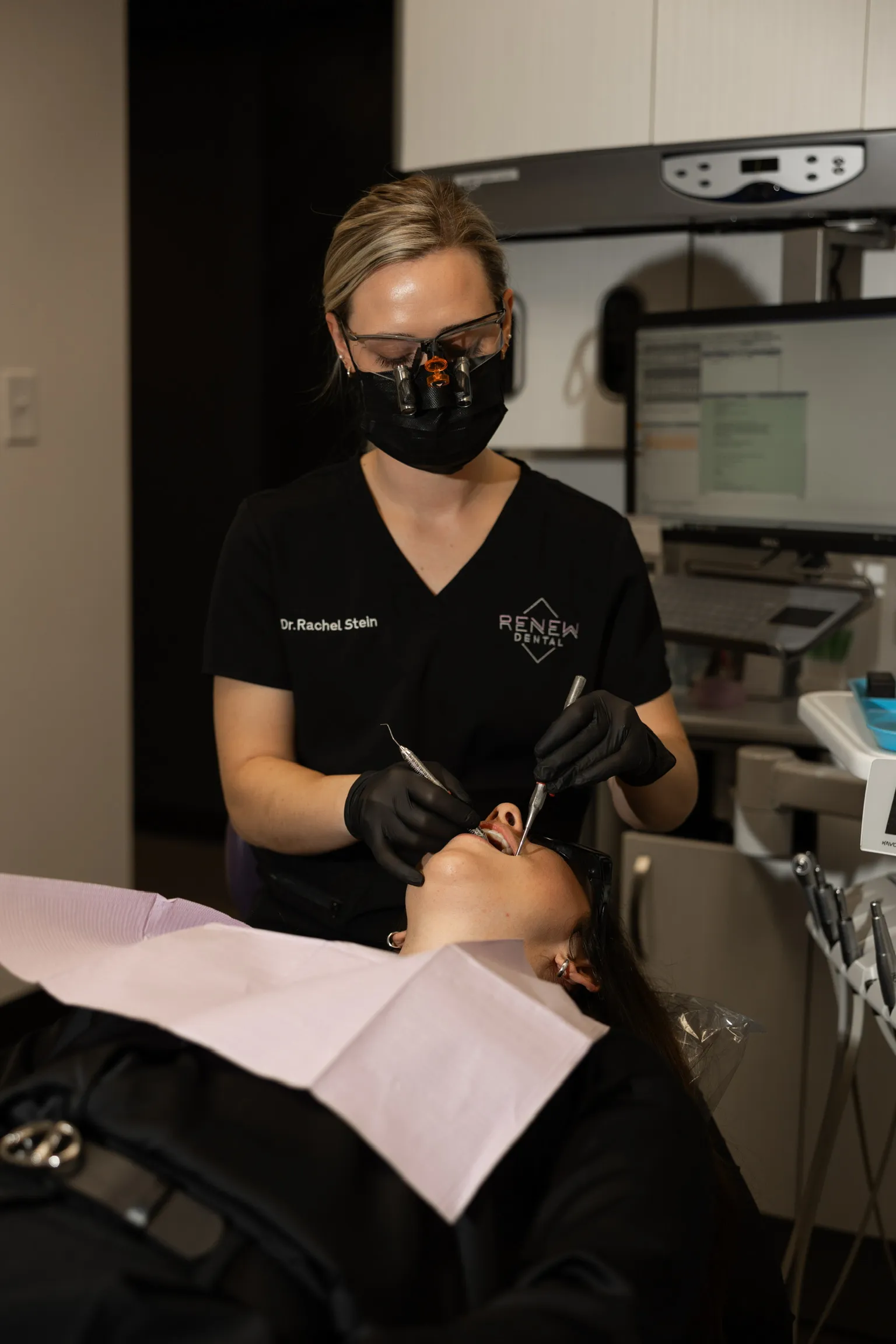 Dr. Stein using high-tech tools and equipment during treatment